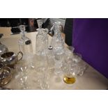 A variety of mixed vintage and antique glass ware including cut glass decanters, etched glasses