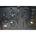 A selection of mixed vintage cut and pressed glass decanters and jugs.