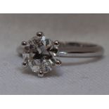 A lady's diamond solitaire dress ring, approx 1.8ct in a raised claw set mount on a white metal loop