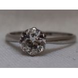 A lady's diamond solitaire dress ring, approx 1ct in a claw set mount to knife blade shoulders on