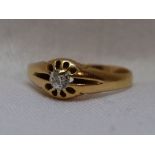 An 18ct gold signet ring having an inset old cut diamond, spprox 0.25ct in a star burst style
