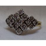 A lady's dress ring having a diamond multi cluster, total approx 1ct in a stepped claw mount to