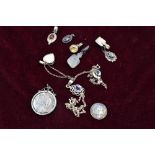 A selection of white metal pendants, most stamped 925, including locket, moonstone, hematite,