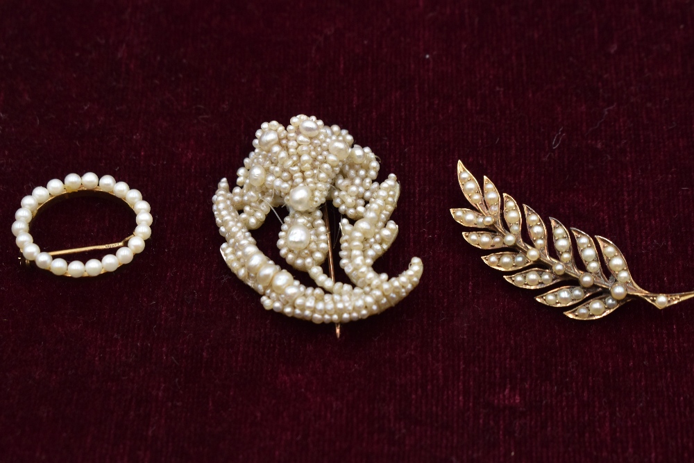 Three seed pearl brooches including leaf form, circular form on yellow metal, marks worn and