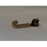 A yellow metal single stud earring with a diamond set heart with a diamond set letter J drop