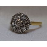 A lady's dress ring having a diamond cluster, total approx 1ct in a pave and claw set mount on a