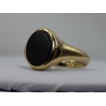 A 9ct gold signet ring having oval jet panel, size L