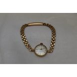 A lady's 9ct gold wrist watch by Mappin having a baton numeral dial to circular face on 9ct gold