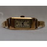 A lady's 9ct gold wrist watch by Cyma having Arabic numeral dial to rectangular case on a gold