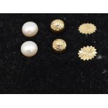 Three pairs of 9ct gold stud earrings including cultured pearl