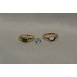 A lady's dress ring having a green stone in an oval collared mount on a 9ct gold loop and another