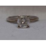 A lady's diamond solitaire dress ring, approx 1.08ct in four claw mount on a white metal loop