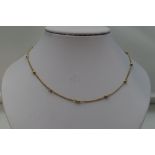 A 9ct gold chain having gold bead links, approx 17' & 4.3g