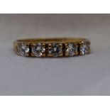 A lady's dress ring having five diamonds, total approx 0.5ct in claw set mounts on a yellow metal