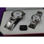 A cased pair of quartz fashion watches by Geneva