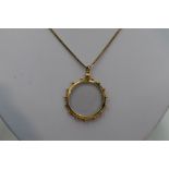 A glass locket in a decorative 9ct gold mount on a 9ct gold box chain, approx 17'