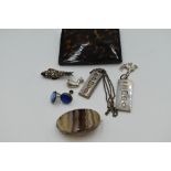 A selection of HM silver and white metal jewellery including ingot pendants, butterfly wing