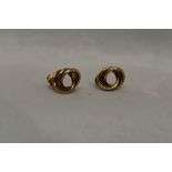 A pair of 9ct gold triple loop stud earrings