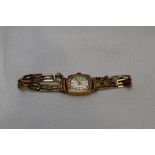 A lady's 9ct gold Bentina wrist watch having a baton numeral dial to a small circular face in a