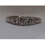 A lady's dress ring having five graduated brilliant cut diamonds, total approx 1ct, in a stepped