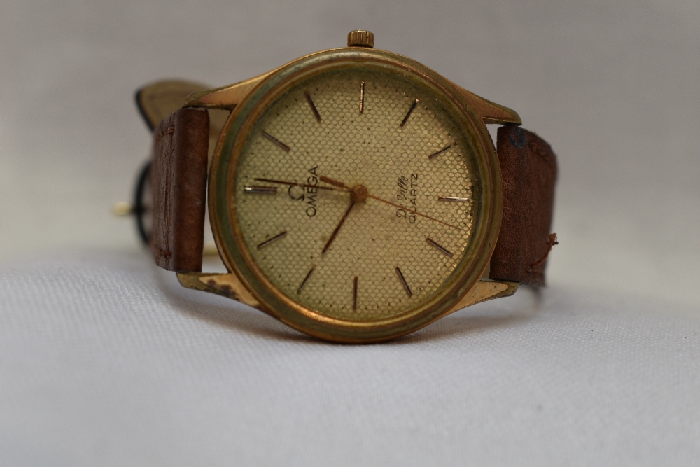 A gent's Omega De Ville gold plated quartz wrist watch having a baton numeral dial to circular