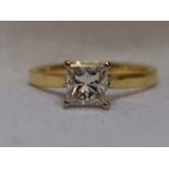 A lady's dress ring having a princess cut diamond solitaire, approx 0.75ct in a four claw raised