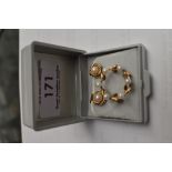 A pair of cultured pearl clip earrings in 9ct gold mounts and a small 9ct gold wreath brooch