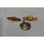 Two 9ct gold bar brooches having wire decoration, one having hair locket to reverse, and a glass