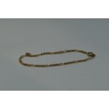 A 9ct gold figaro chain bracelet