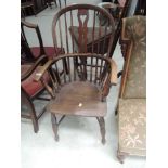 A 19th Century beech and elm hoop and stick back Windsor armchair having solid seat and crinoline