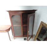A Victorian mahogany bookcase top having inlay decoration on later cabriole feet, approx