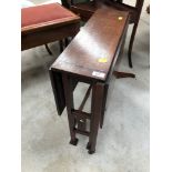 An Arts and Crafts dark oak gateleg occasional table in the Arthur Simpson Handicrafts style, open