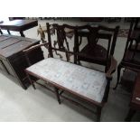 An Edwardian mahogany salon settee having floral and line inlay decoration with double splat vase