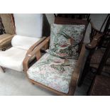 A 1930's oak frame armchair of Art Deco design with floral upholstery , width approx. 62cm