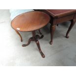 An early 20th century mahogany occasional table in the 18th century pedestal style having circular