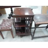 An early 20th Century revolving bookcase having slat sections on base, width approx. 48cm