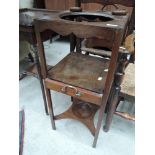 An early 19th century mahogany George III washstand, having upper bowl recess, over drawer and