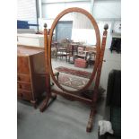 A mid 20th Century part satinwood cheval mirror in the French style having large oval mirror panel