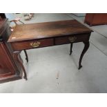 A 19th century mahogany side table having rectangular to with two frieze drawers on slender cabriole