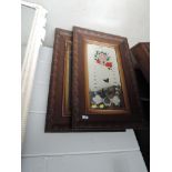 A pair of Victorian wall mirrors having carved oak frame and painted and etched floral decoration,