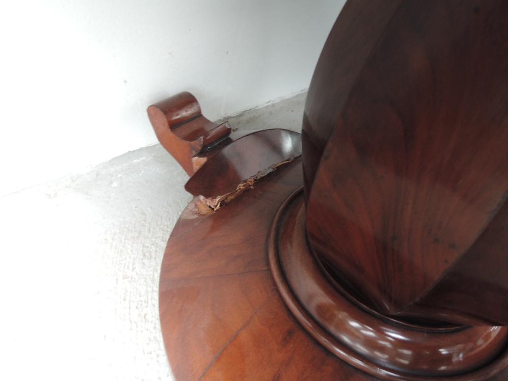 An early Victorian mahogany tea table having swivel top on cocia nut pedestal and circular - Image 2 of 2