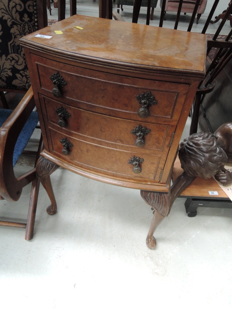 A mid 20th Century burr walnut period style bedside chest of three drawers on cabriole legs, width