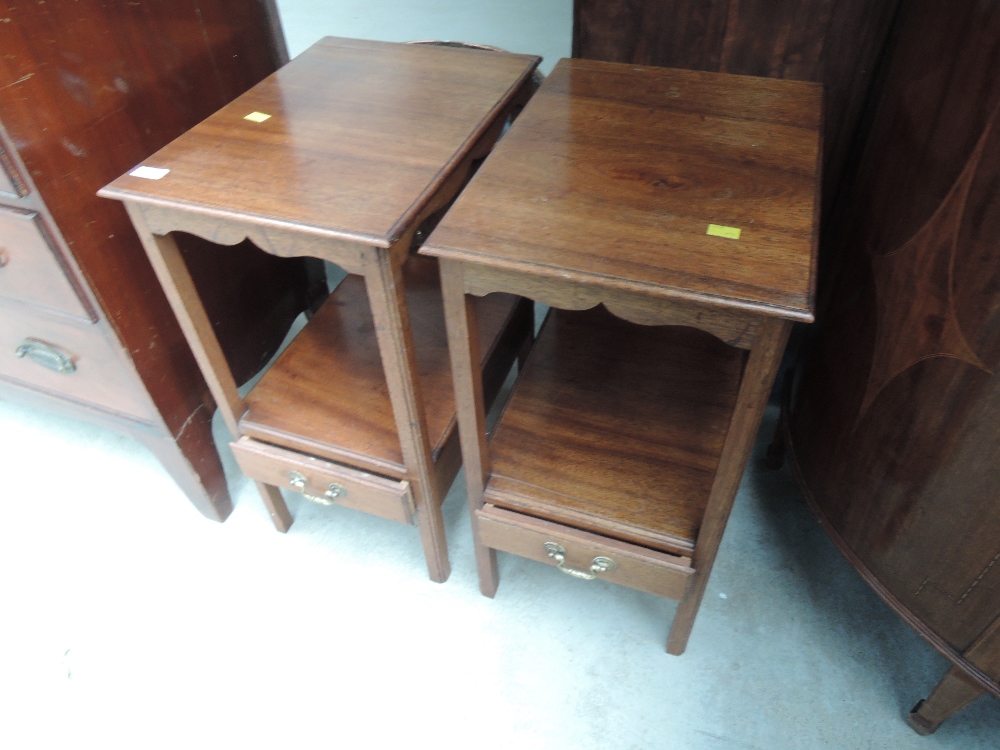 A pair of 20th century mahogany night stands in the Georgian style having drawer tiers