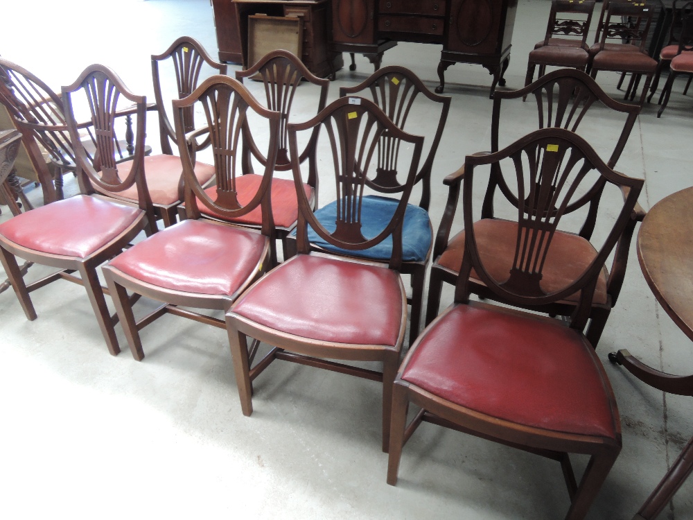A set of eight (6 + 2) 20th Century mahogany dining chairs in the Hepplewhite style having shield