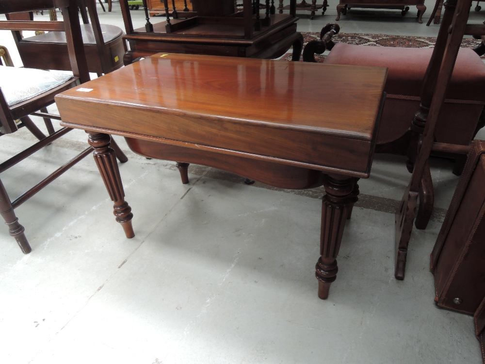 A 20th Century mahogany period style commode stool having inset panel and reeded legs, width approx.