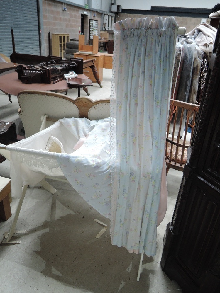 An early 20th century painted X French canopy child's crib, having later linen, collectors items