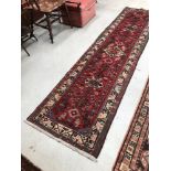 A rug of Middle Eastern design having multi colour ground, approx. 290 x 70cm
