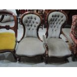 A Victorian walnut frame, spoon back armchair having later green dralon upholstery having applique