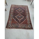 A 20th century rug of Eastern design having blue, red and cream ground, approx 122 x 183cm
