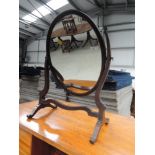 A late 19th Century mahogany toilet mirror of oval shape, width approx. 40cm